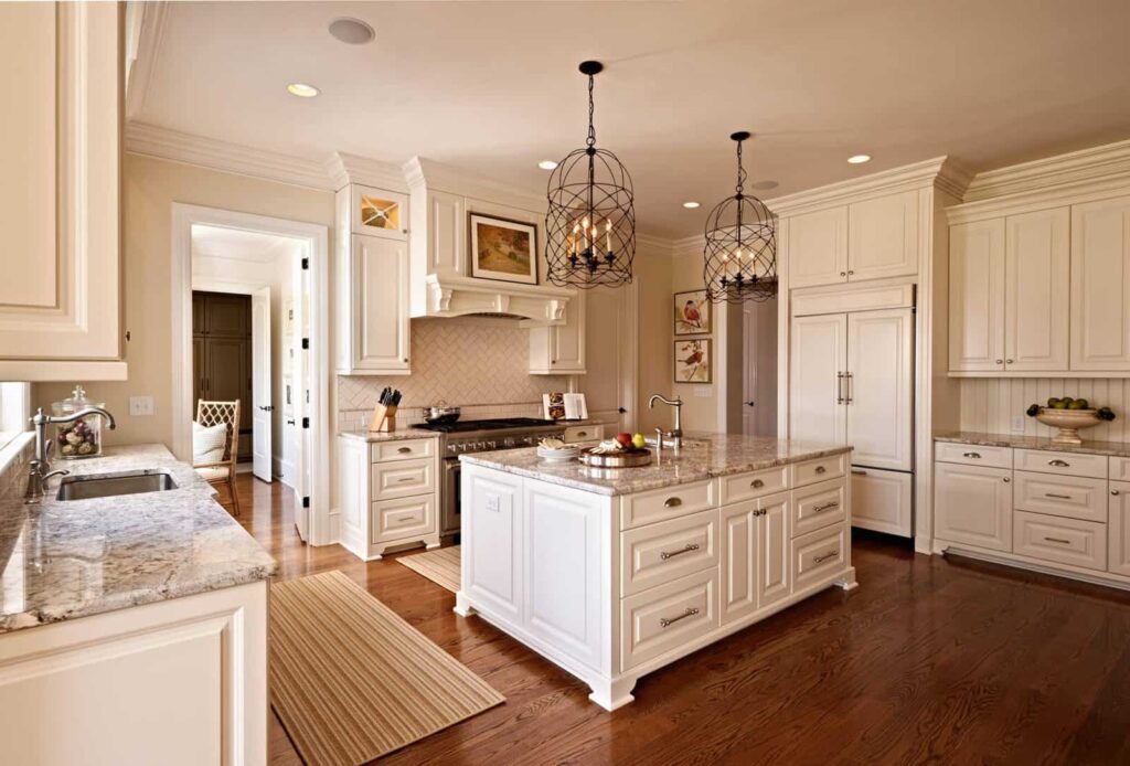 Traditional kitchen featuring white painted cabinets
